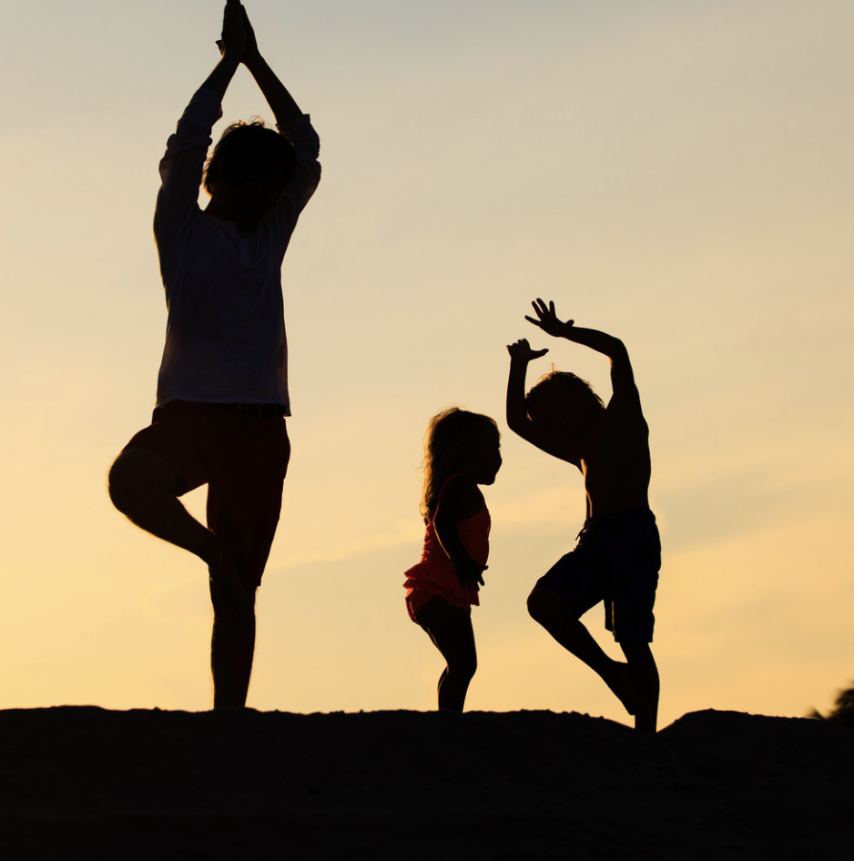 family yoga outside silhouette 